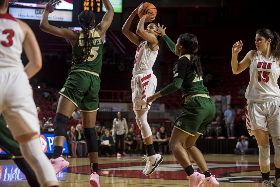 WKU forward Tashia Brown (10) shoots for two against forward Nyilah Jamison-Myers (15) during the Lady Toppers 83-61 win over University of North Carolina at Charlotte on Friday, Feb. 23, 2018 at Diddle Arena. Brown had nine rebounds during her her 37 minutes on the court.