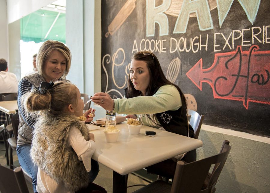 Melissa Pierce (left), Kenzley Carroll (center) and Lauren Carroll (right) enjoy cookie dough from Raw, a new raw cookie dough bar that opened Thursday, February 8 in the Square. The cookie dough bar was opened by Bailey Dahliquist, a WKU junior.