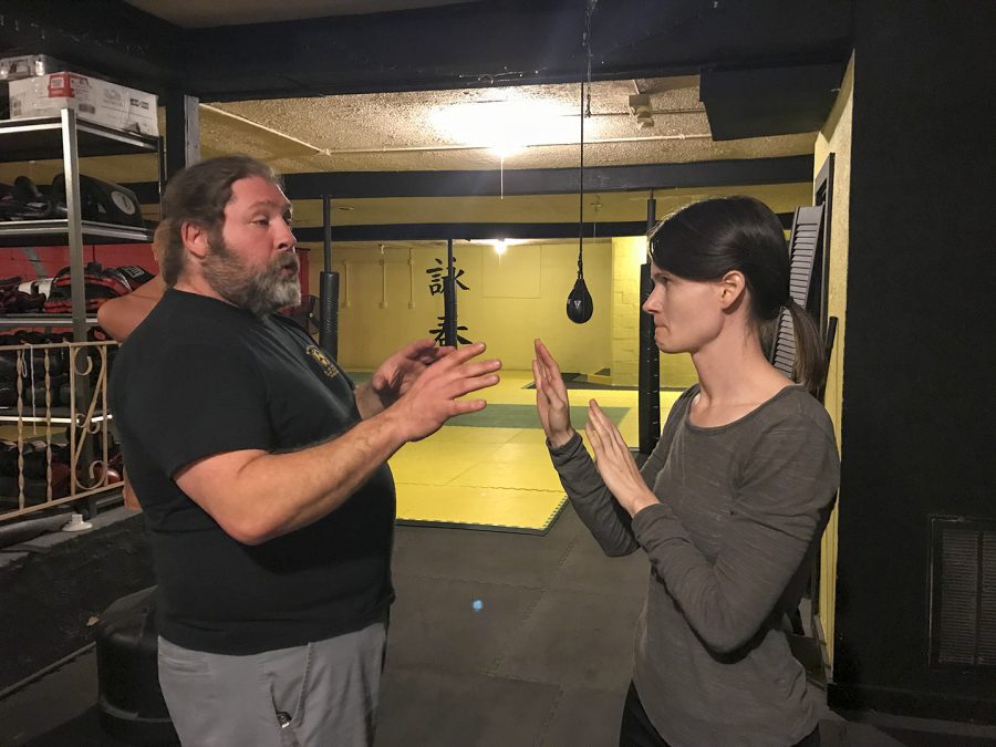 Kevin Taylor trains Jane Schoenbaechler during the Womens Self-Defense class on Feb. 10. Schoenbaechler said she was glad to become more situationally aware.