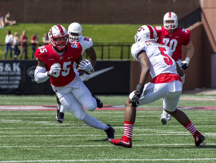 Redshirt senior Mik’Quan Deane (85) rushes the ball upfield for the Red Team. The Red Team won the spring football game 24-14 on April 21 at Houchens-Smith Stadium.