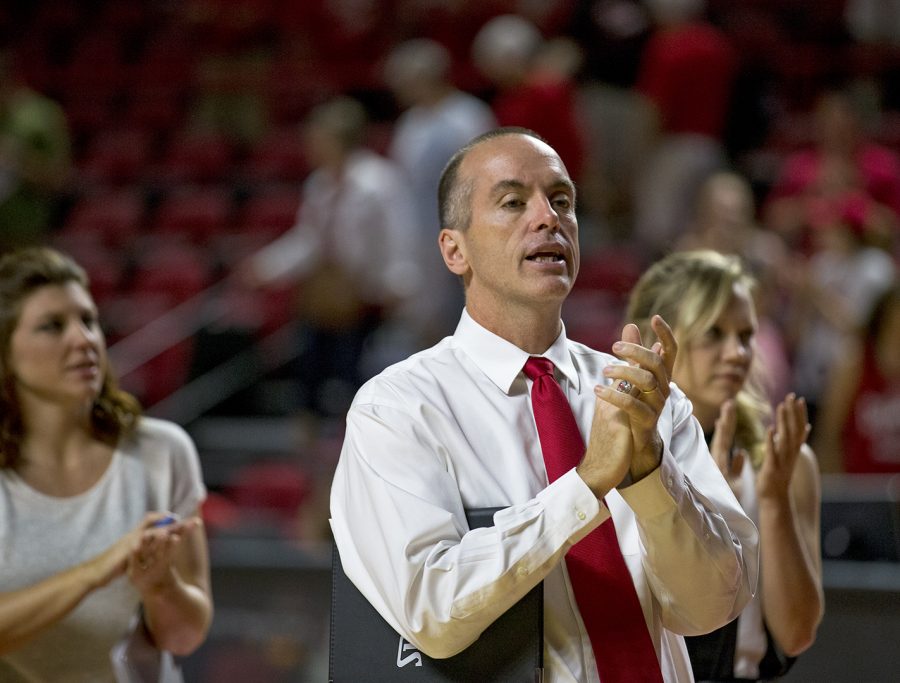 WKU women's head coach Travis Hudson cheers on his team as they play against Tennessee State on Tuesday in Diddle Arena.