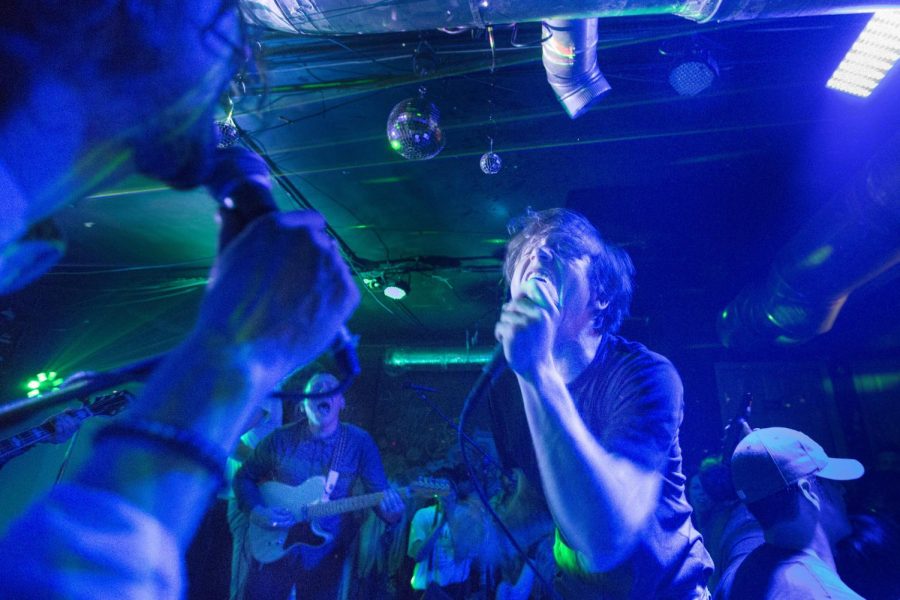 Nick Bockrath (left) and Matthew Shultz (center) sing with their band Cage the Elephant at Rockys Thursday, Jan. 30, in Bowling Green. The show — the bands first at Rockys — would be Cage the Elephants last performance in the States before it kicked off its European tour. (Mike Clark/HERALD)