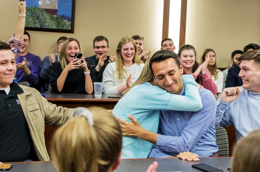 WKU Student Body President elect Stephen Mayer hugs his administrative vice president Harper Anderson after hearing that their ticket won the SGA election. A crowd gathered in DSU until after midnight on April 18 to hear the results.