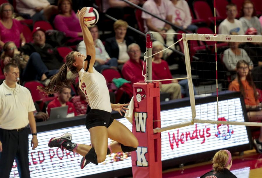 WKUs outside hitter Alyssa Cavanaugh (7) spikes the ball towards UTSA during the final set of the Lady Toppers 3-1 win Friday at E.A. Diddle Arena.