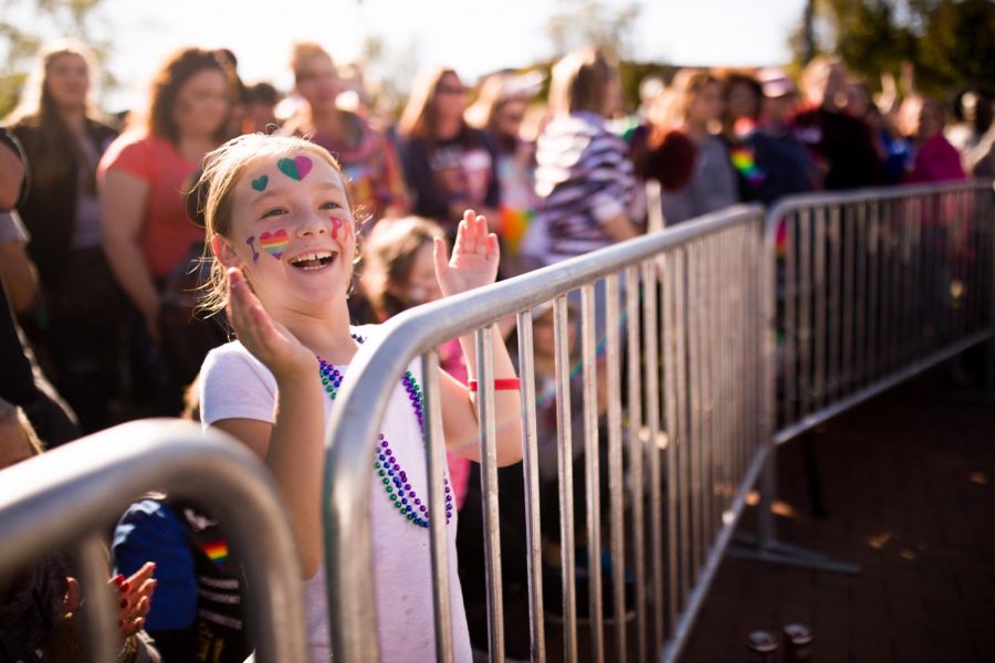 Kailee Parker, 8, of Bowling Green, Ky., cheers in the front row for the drag performances with her mom, Devan Parker, at the 2018 Bowling Green Pride Festival. “We got family that we love,” said Devan. “We have a lot of gay people in the family. I’m teaching her to love tolerance.”