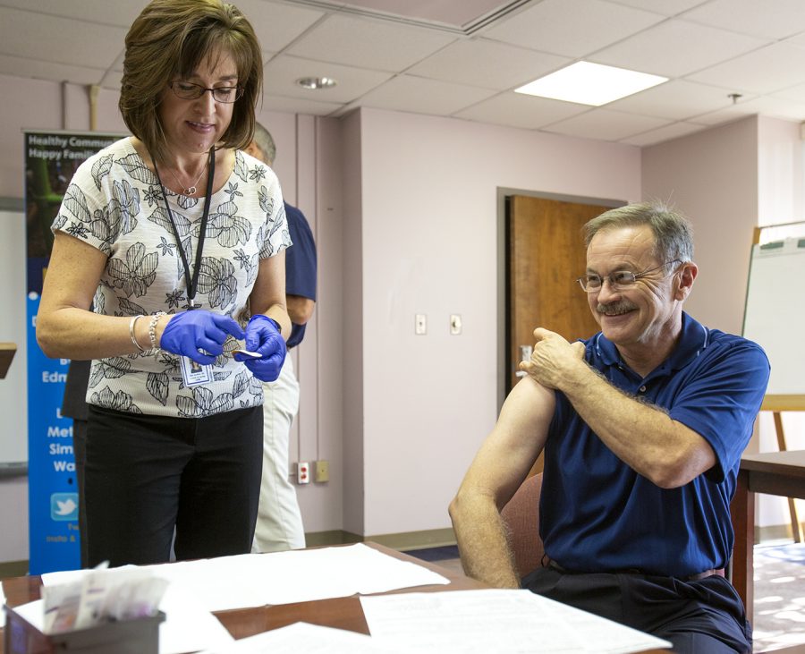 Director of nursing Julia Davidson gives Mayor Bruce Wilkerson his flu vaccination at the Barren River District Health Department in Bowling Green on Wednesday, October 3, 2018.