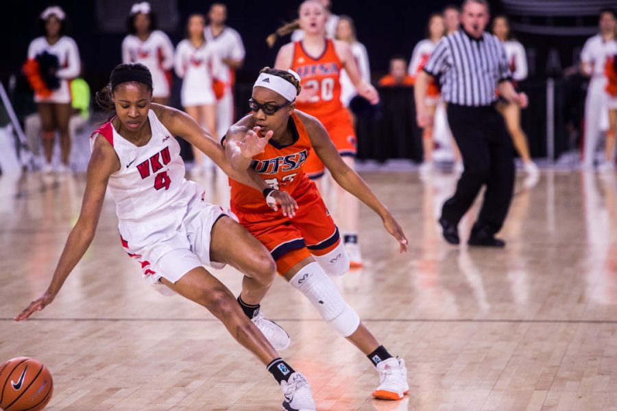WKU Forward Dee Givens (4) and UTEP Guard Barbara Benson (33) go after a loose ball during the Lady Toppers 78-50 win in first game of the Conference USA tournament against University of Texas at San Antonio on Thursday March 8, 2018 at The Star in Frisco, Tx. Givens scored 10 points in the Lady Toppers win.