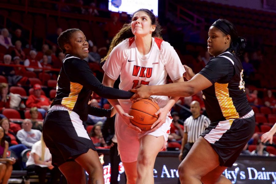 WKUs+sophomore+center+Raneem+Elgedawy+drives+to+the+hoop+with+two+Southern+Mississippi+defenders+holding+hands+to+block+her+attempt+in+Diddle+Arena+on+Jan.+24.%C2%A0+HERALD%2F+Joseph+Barkoff