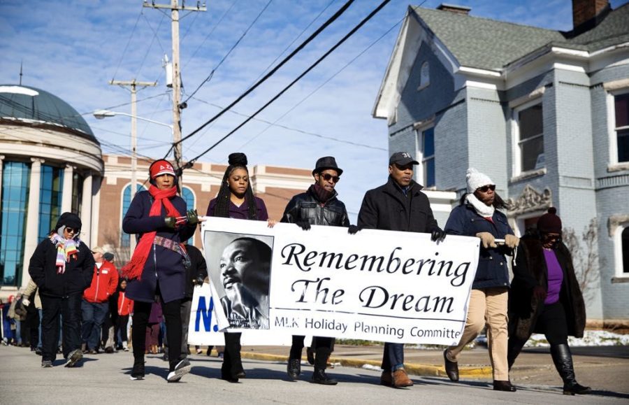 Folks march from Warren County Justice Center to the State Street Baptist Church to commemorate Dr. Martin Luther King Jan. 21 in Bowling Green.