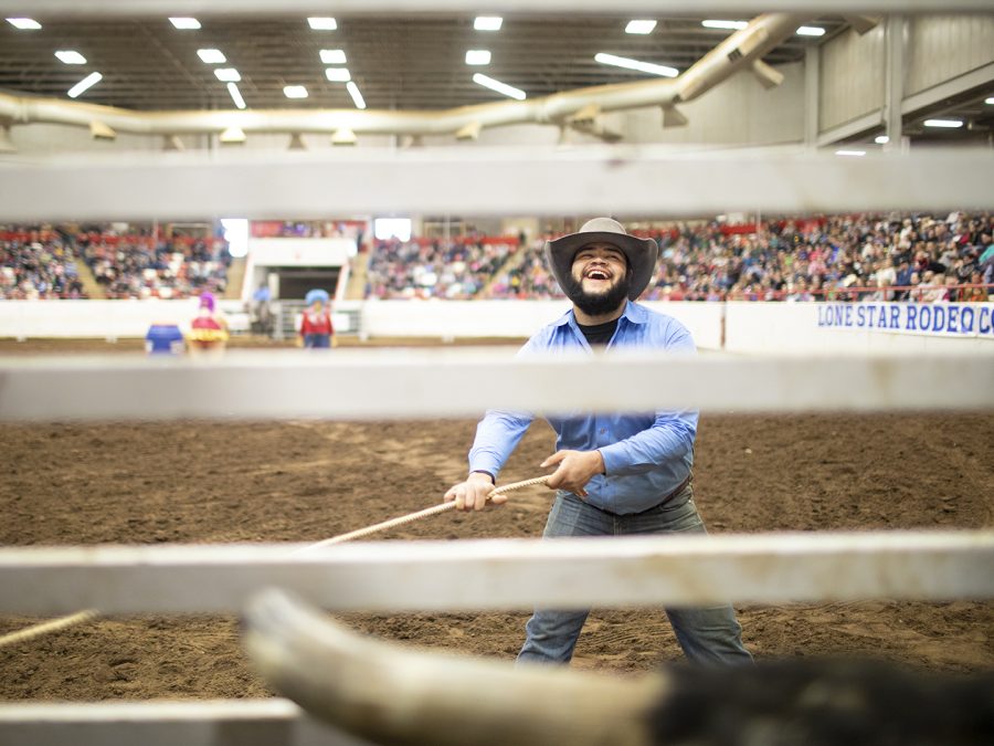Jamin Turner, 23, of Dickson Tenn., is standing ready to release the bull for the bull riding competition at the Lone Star Rodeo Company at the WKU L.D. Brown Ag Expo Center on Sat. Feb, 9, 2019. Turner has been working for four years with the stock and opening the chutes for animals to come out. Before this job, Turner started off riding bulls for three and half years.