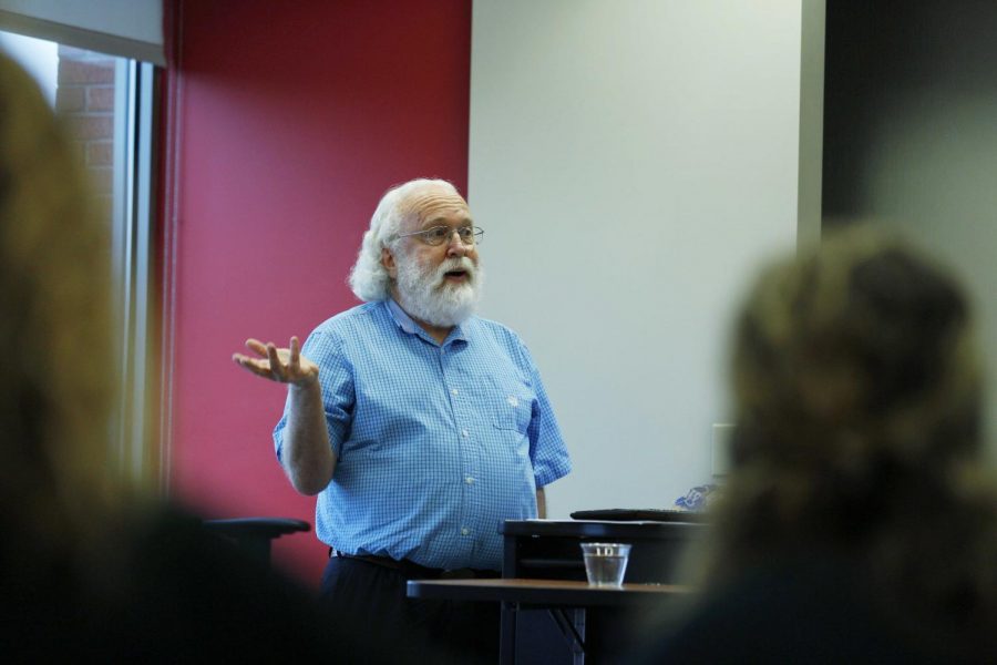 Folk studies associate professor, Tim Evans gives a lecture on education and community: service learning as a high impact practice during the monthly social justice salon series in the Downing Student Union on Tuesday, Feb. 19.