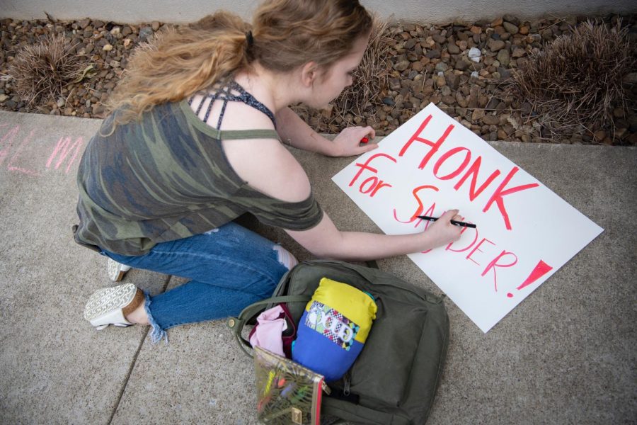 Freshman Kaetlyn Jeffries, of Frankfort, Ky.,  creates a sign to hold up during a protest outside of the Wetherby Administration Building. “It shows they’re not afraid to make some noise about it,” she said. Jeffries, a theater and dance student, joined other protesters who gathered on Thursday, March 28, 2019, after Larry Snyder’s sudden resignation as the dean of Potter College the previous day.