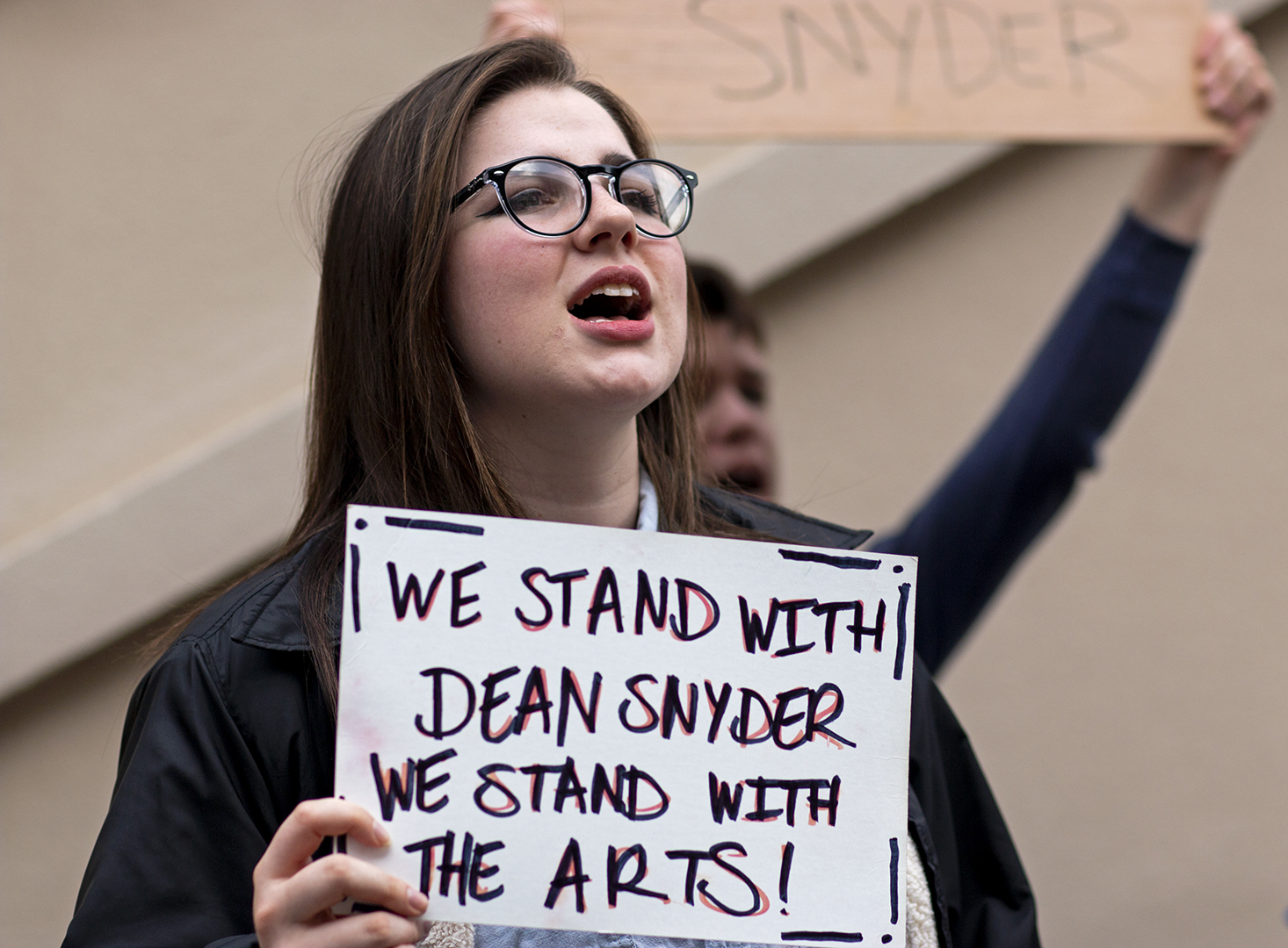 WKU musical theatre student Hailey Armstrong chant Tell us why. We want to know, with other protesters outside of Potter Hall and in front of the Wetherby Administration Building on Friday, March 29 following the sudden resignation of former Potter College Dean Larry Snyder. Dean Snyder was one that often fought for us PCAL students because he realized the importance of Arts and Humanities, Armstrong said. Its been a great experience to feel supported by my fellow protestors and students that arent even in Potter College. Even a passing car honking and waving as they go by shows me that even though the attitude of this universitys administration is one of disregard for the arts, people still understand what we do and why its important.