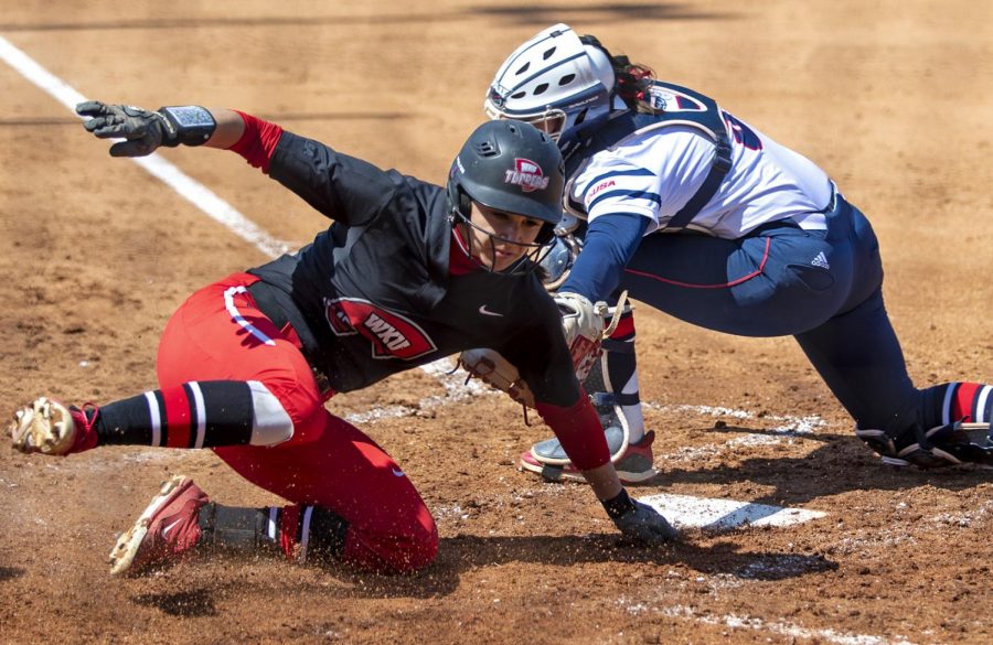 Kendall Smith slides into home during game against Florida Atlantic on Sunday, March 31, 2019. WKU won the game with a final score of 10-2.