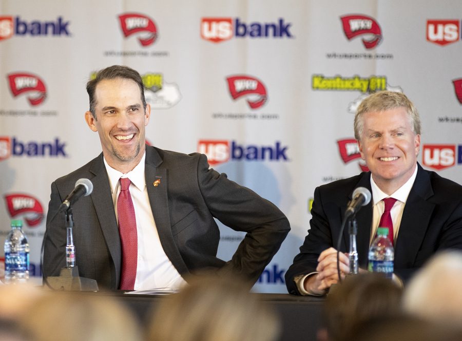 WKUs new head coach Tyson Helton (left) shares a smile with WKU athletic director Todd Stewart (right) during Heltons first press conference as the new head coach of the Hilltoppers at the Harbaugh Club in Houchens-Smith Stadium Nov. 27 in Bowling Green. Its not about making championships, Helton said. Its about making champions. Helton comes to WKU after working for Tennessee and Southern California.