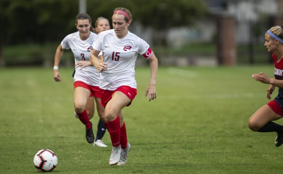 WKU midfielder Ambere Barnett (15) dribbles the ball upfield agents Belmont during the season opener at the WKU Soccer Complex on Thursday, Aug. 22, 2019.