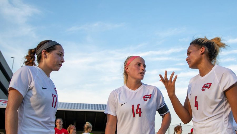 Christina Bragado (left) Kaylyn Bryant (center) and Lyric Schmidt (right) deliberate during halftime of Sundays exhibition match against Austin Peay.