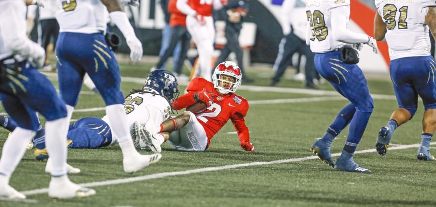 WKU wide receiver Jacquez Sloan (2) tackled by FIU defensive back Rishard Dames (35) during a homecoming football game 38-17 loss against Florida International university on Saturday, Oct 27, at Houchens L.T. Smith Stadium