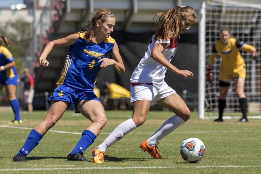 Freshman Defender, Aleksandra Kozovic (31) dribbles the ball away from Morehead States Freshman Defender Emily Gunsett (4) during the Lady Toppers 2-0 win over the Eagles on Sunday, September 11th. 2016 at WKU Soccer Complex.