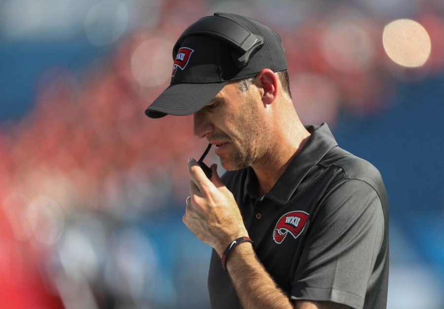 WKU Hilltoppers head coach Tyson Helton reviews his notes during WKUs 38-21 loss against Louisville Cardinals in Nissan Stadium on Sept. 14, 2019 Fahad Alotaibi/HERALD