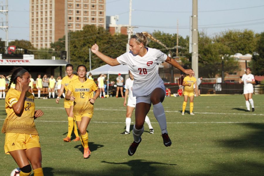 WKU forward Ansley Cate (20) jumps to play the ball during a home game against Southern Miss on Saturday, Sept. 21, 2019. The Lady Toppers won the game in a double-overtime thriller.