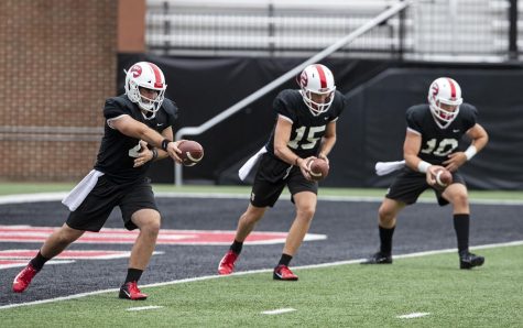 Ty Storey (4) practices with the WKU quarterbacks during WKU football practice on Monday, Aug. 26, 2019 at Houchens-Smith Stadium.