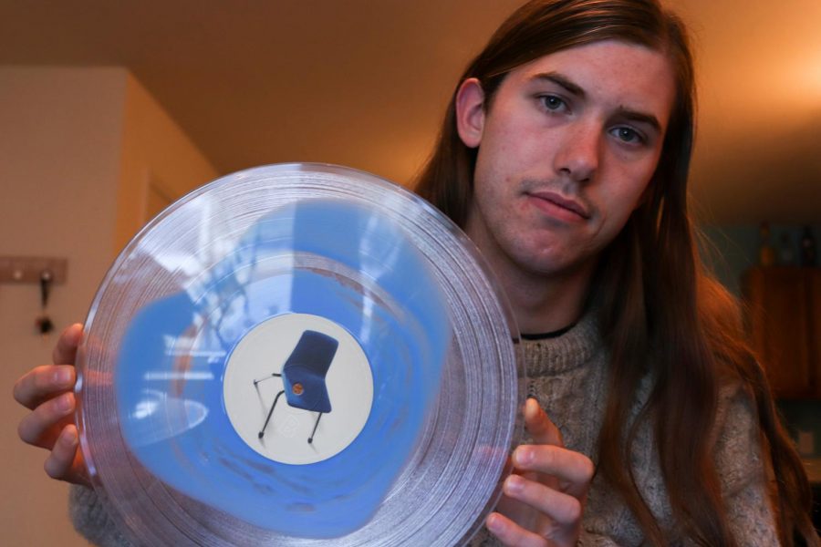 Herald Features Editor Griffin Fletcher holds his vinyl copy of Dan Luke and the Raid’s debut LP, Out Of The Blue.