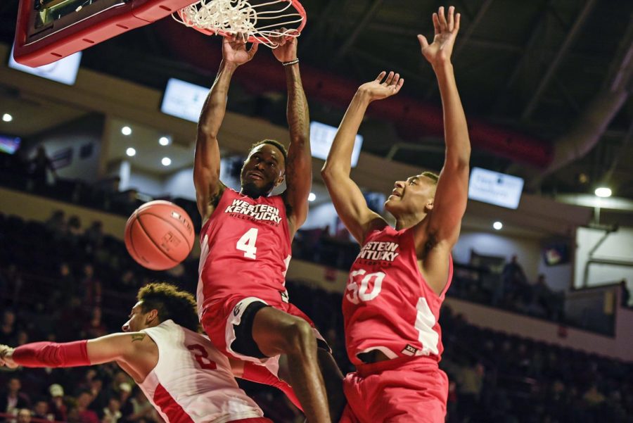Josh Anderson 4) and Isaiah Cozart (50) score on a rebound during a scrimmage match against their own team in the Hill Topper Hysteria event in the Diddle arena on Oct. 16 2019.