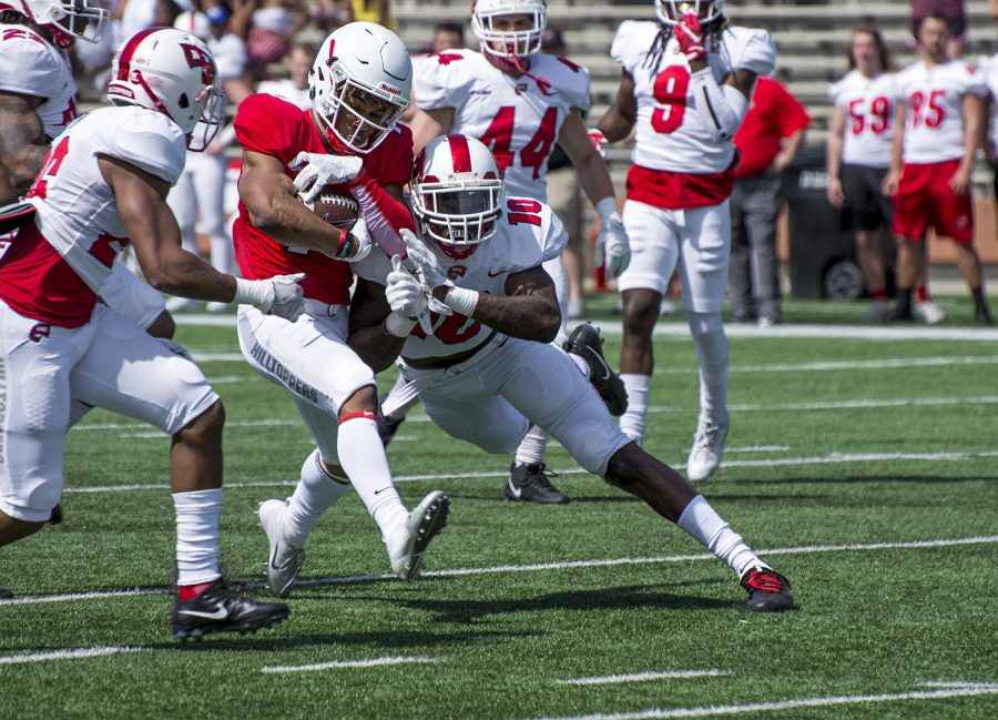 Sophomore defensive lineman DeAngelo Malone (10) brings down the ball carrier during the spring game at L.T. Smith Stadium on April 21.