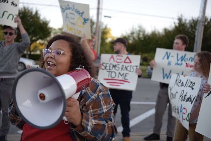 WKU junior Symone Whalin takes charge of the megaphone as she calls for WKU authorities to punish certain sororities for videos showing members using racial slurs. The protest took place Tuesday evening outside SKyPAC during the annual Kappa Delta Shenanigans event.
