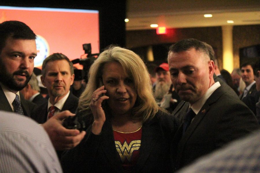 The woman who rushed the stage and unfoundedly declared Matt Bevin the winner of the gubernatorial election gets escorted out of the Galt House in Louisville on Nov. 5, 2019. 