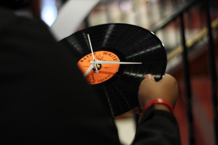 Visitors to the Market on the Anevue information fair could learn about upcycling by making clocks out of old vinyl albums. Upcycling involves creating new, more usable items out of old, underused items.