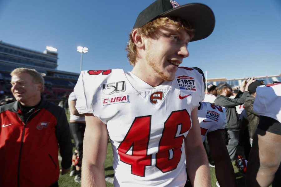 WKU freshman kicker Cory Munson (center) celebrates with WKU athletic director Todd Stewart (left) and his teammates after nailing a game-winning 52-yard field goal during an untimed down at the end of regulation. WKU defeated Western Michigan in the First Responder Bowl 23-20 in Gerald Ford Stadium in Dallas.