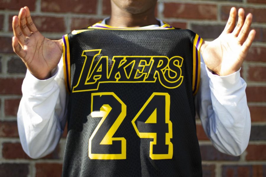 A WKU student poses with a Kobe Bryant jersey the day after his passing on Monday, Jan. 27, 2020.