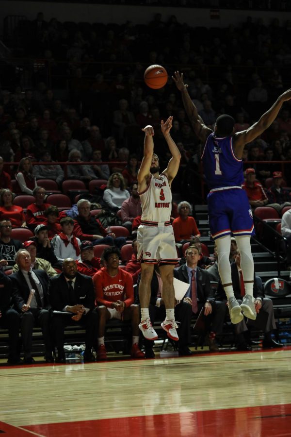 WKU graduate senior guard Camron Justice tries a 3-pointer in the corner during WKUs 15-point comeback in the last four minutes of the game. Justice shot 4 for 8 from deep for 14 points, as the Hilltoppers defeated the Bulldogs 95-91 in OT in Diddle Arena on Feb. 27, 2019.