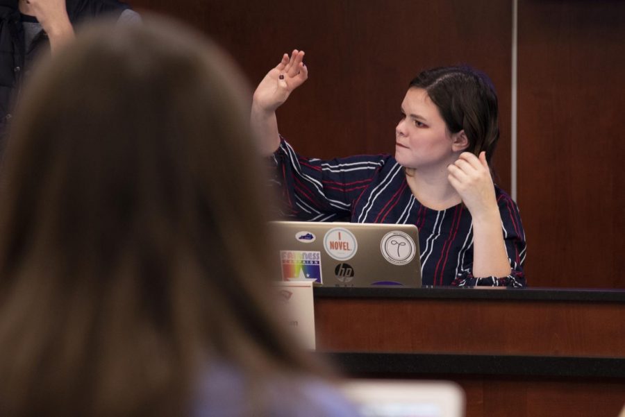 Brigid Stakelum, SGA Public Relations Committee Chair, raises her hand to speak during the student senate meeting on Tuesday, February 11.