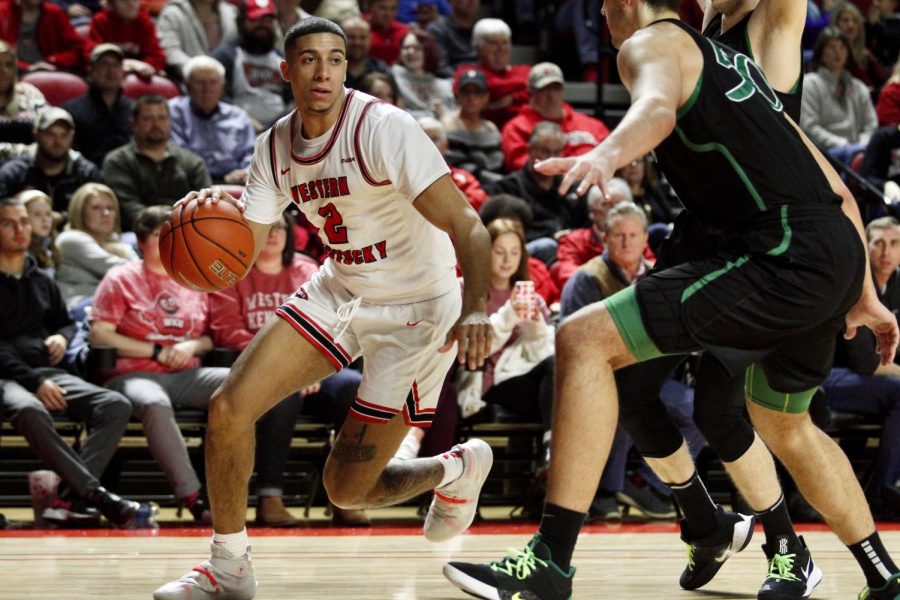 Redshirt+senior+wing+Jared+Savage+%282%29+dribbles+inside+during+the%C2%A0WKU+Hilltoppers+91-84+win+over+the+Marshall+Thundering+Herd+on+Saturday%2C+Jan.+25+in+Diddle+Arena.