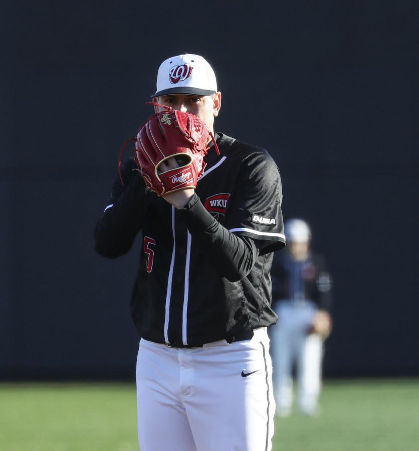 Redshirt+junior+pitcher+Michael+Darrell-Hicks+%2815%29+peers+over+his+glove+during+the+WKU+baseball+game+against+Wright+State+on+Feb.+21%2C+2020+at+Nick+Denes+Field.