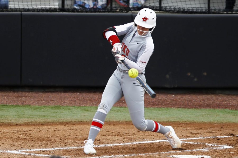 WKU first baseman Maddie Bowlds connects with the pitch from University of Wisconsin-Green Bay pitcher Becky Baneck sending the ball to center field only to be caught for the 3rd out in the bottom of the second inning. The Hilltoppers defeated the Phoenix 3-0 to take 3rd place in the Hilltopper Classic February 23, 2019.