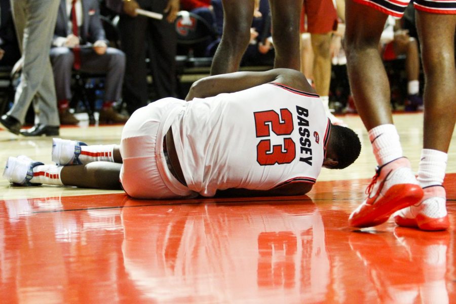 WKU+center+Charles+Bassey+%2823%29+goes+down+after+sustaining+a+leg+injury+in+the+second+half.+The+Hilltoppers+defeated+the+Razorbacks+86+-+79+in+Diddle+Arena+on+Saturday%2C+December+7%2C+2019.