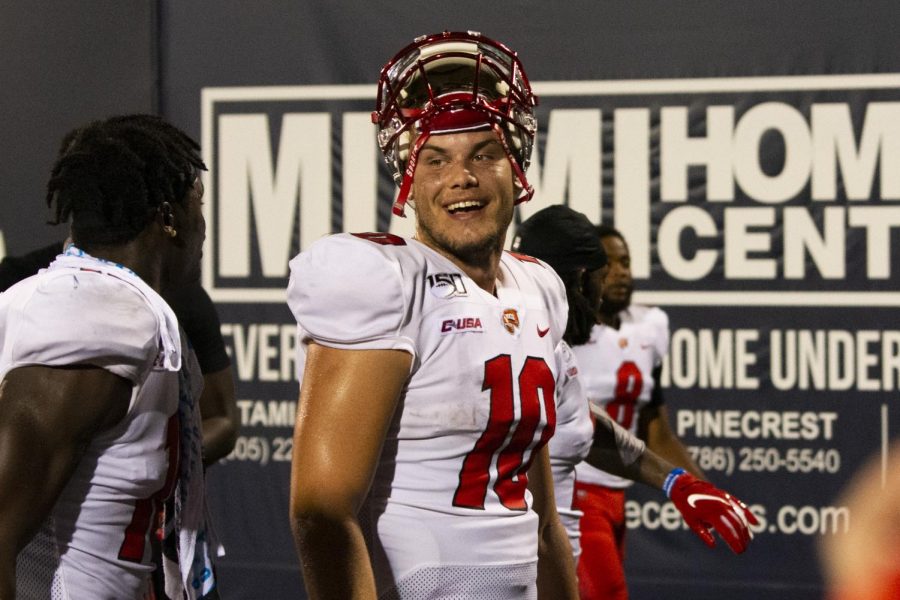 WKU quarterback Steven Duncan (10) smiles as he walks off the field after the Hilltoppers’ 20-14 win over FIU at Riccardo Silva Stadium in Miami, Fla. on September 7, 2019.
