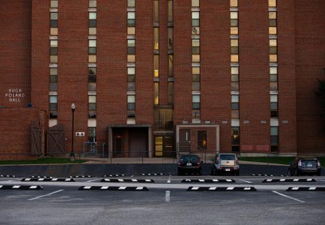 Hugh Poland Hall, like most other dorms, was vacated in a matter of days. Housing parking lots are similarly empty as students move home and Parking and Transportation Services refunds parking passes.