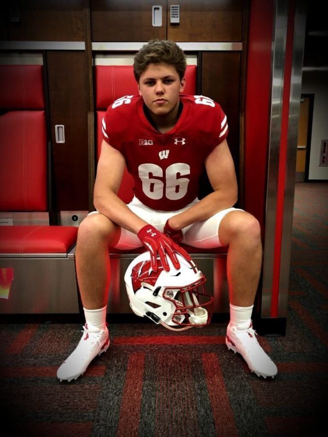 Nolan Rucci, a five-star tackle, poses during a recruiting visit to Wisconsin. 