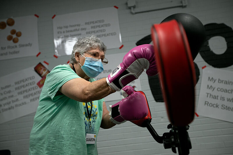Sharon Young exercises in a workout circuit at the gym on Sept. 10. Rock Steady Boxing helps participants with Parkinson’s disease to improve motor skills and balance.