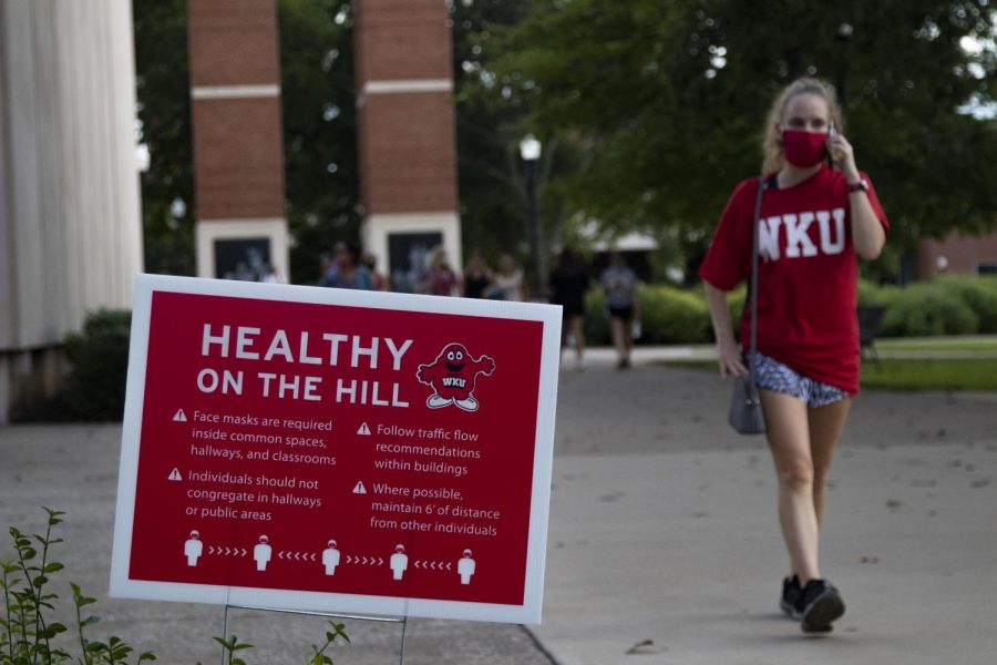 Signs placed around campus remind students how to be safe and stay healthy while on campus by wearing masks and social distancing from other students.