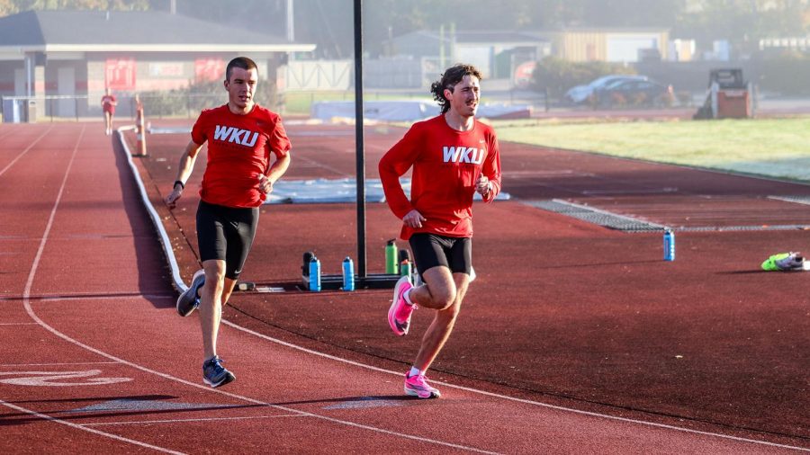 WKU cross-country runners (left) sophomore Anthony Sweet and (right) sophomore Jacob Skillman practicing at Charles M. Ruter Track and Field Complex. 