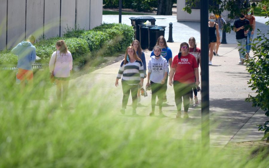 A group of WKU students walk across campus on Aug. 22, 2020. Masks are required at all times in public on campus.