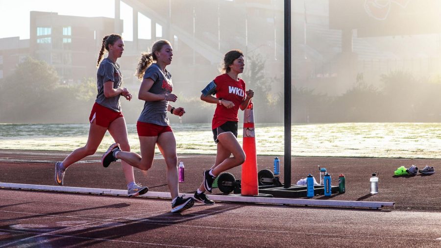WKU womens runners (left) senior Haley Webb, (middle) senior Savannah Heckman, and (right) freshman Rory OConnor conditioning at Charles M. Ruter Track and Field Complex. 