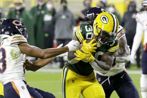 Green Bay Packers Jamaal Williams runs for a touchdown during the second half of an NFL football game against the Chicago Bears Sunday, Nov. 29, 2020, in Green Bay.