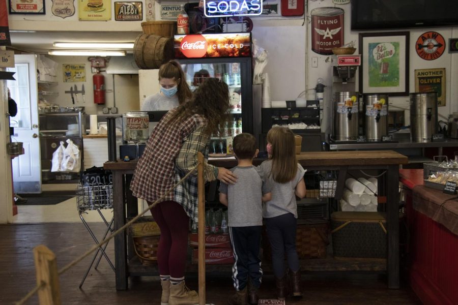 Isabelle Graves checks out at Boyce General store with children Noah and Ella Glass. They stopped in the store for a bite to eat while Noah and Ella Glass’ parents were at work.